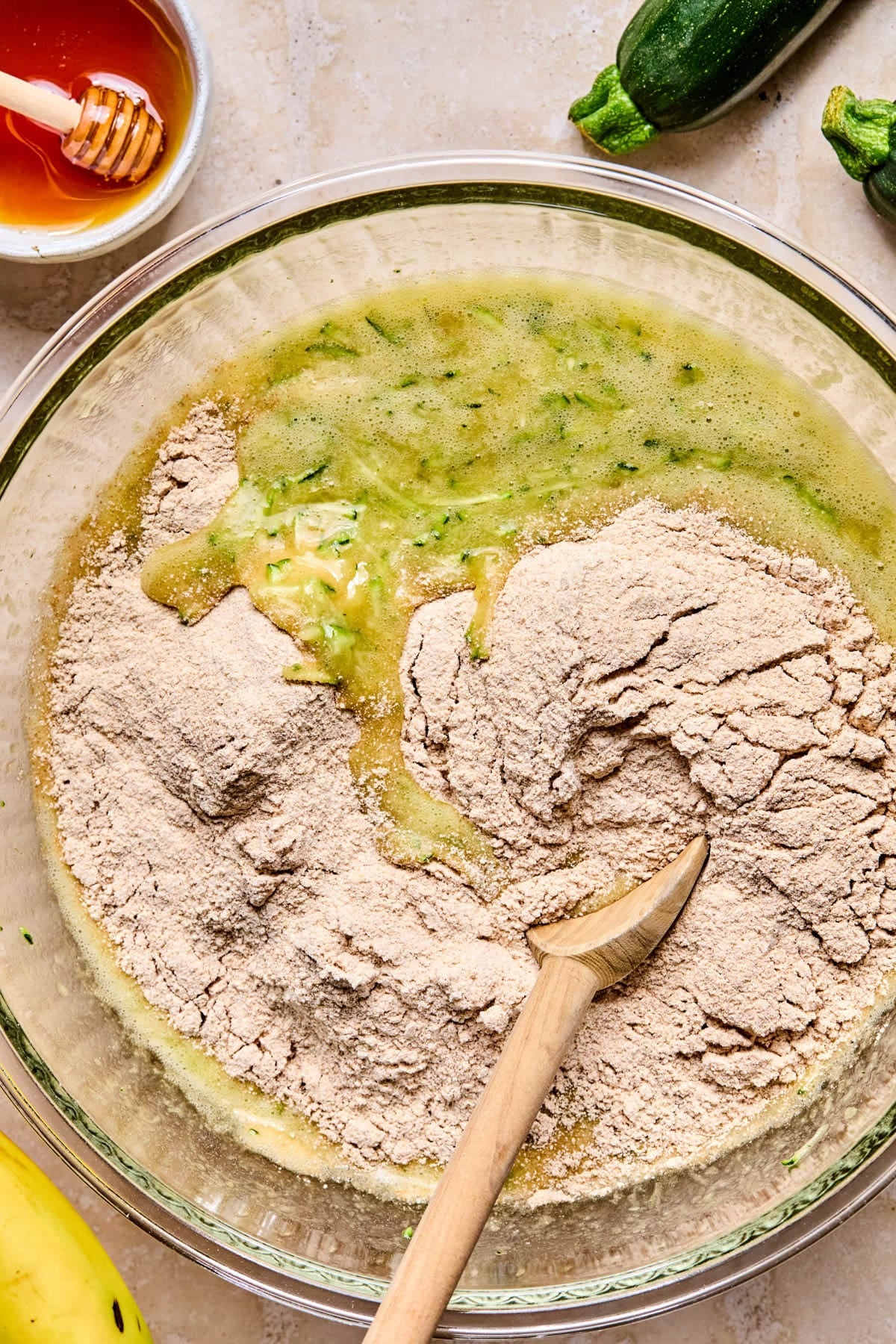 The dry ingredients in the bowl with the wet ingredients before mixing.