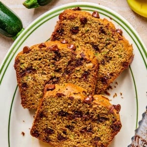 The sliced zucchini banana bread on a plate.