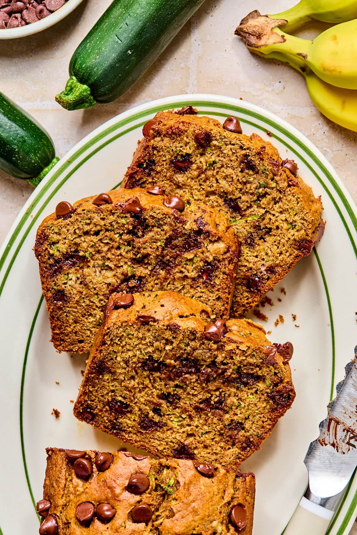 The sliced chocolate chip zucchini banana bread on a plate.