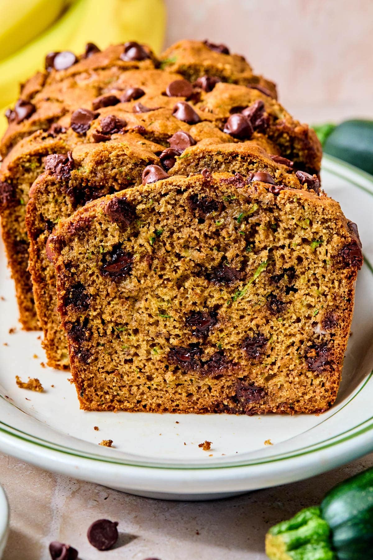 Sliced zucchini banana bread on a plate.