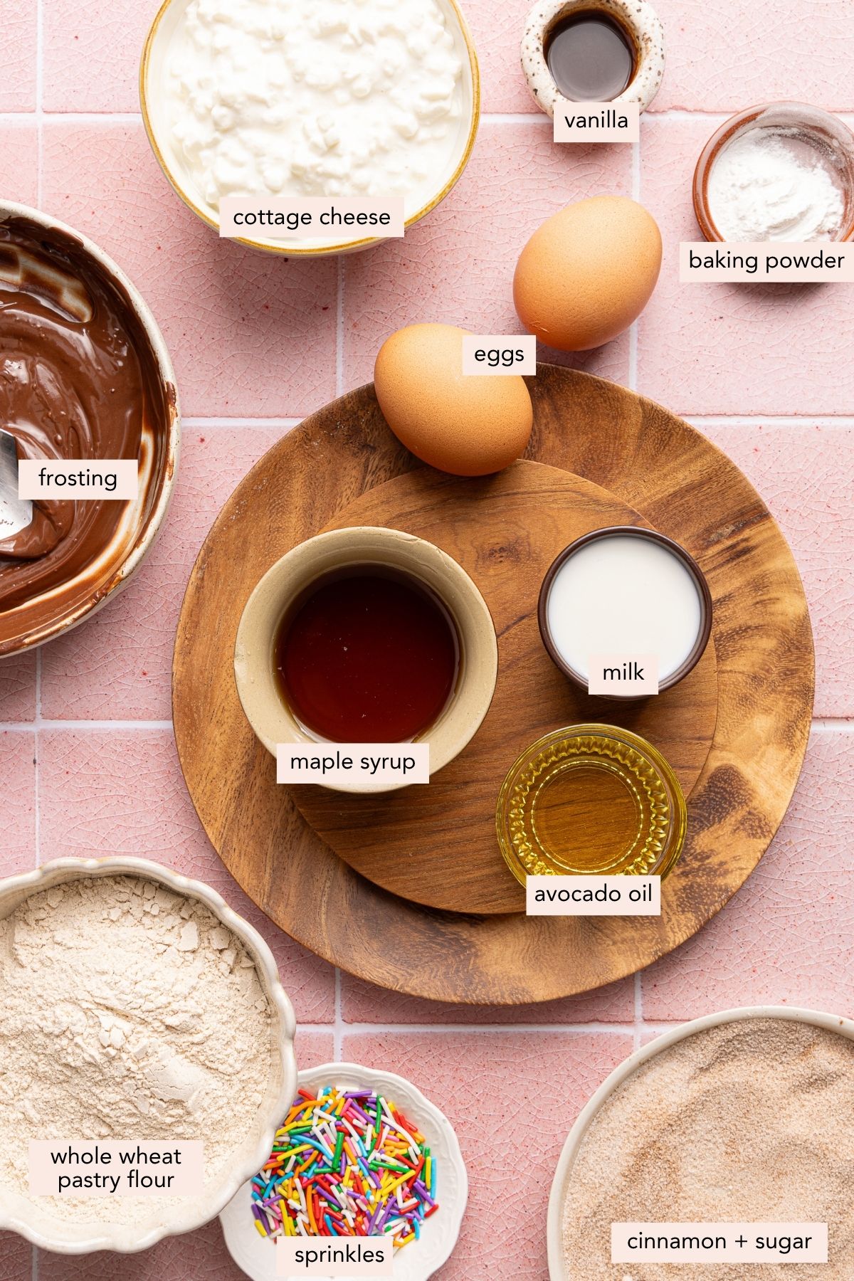 All of the ingredients for cottage cheese donuts in bowls on a countertop.