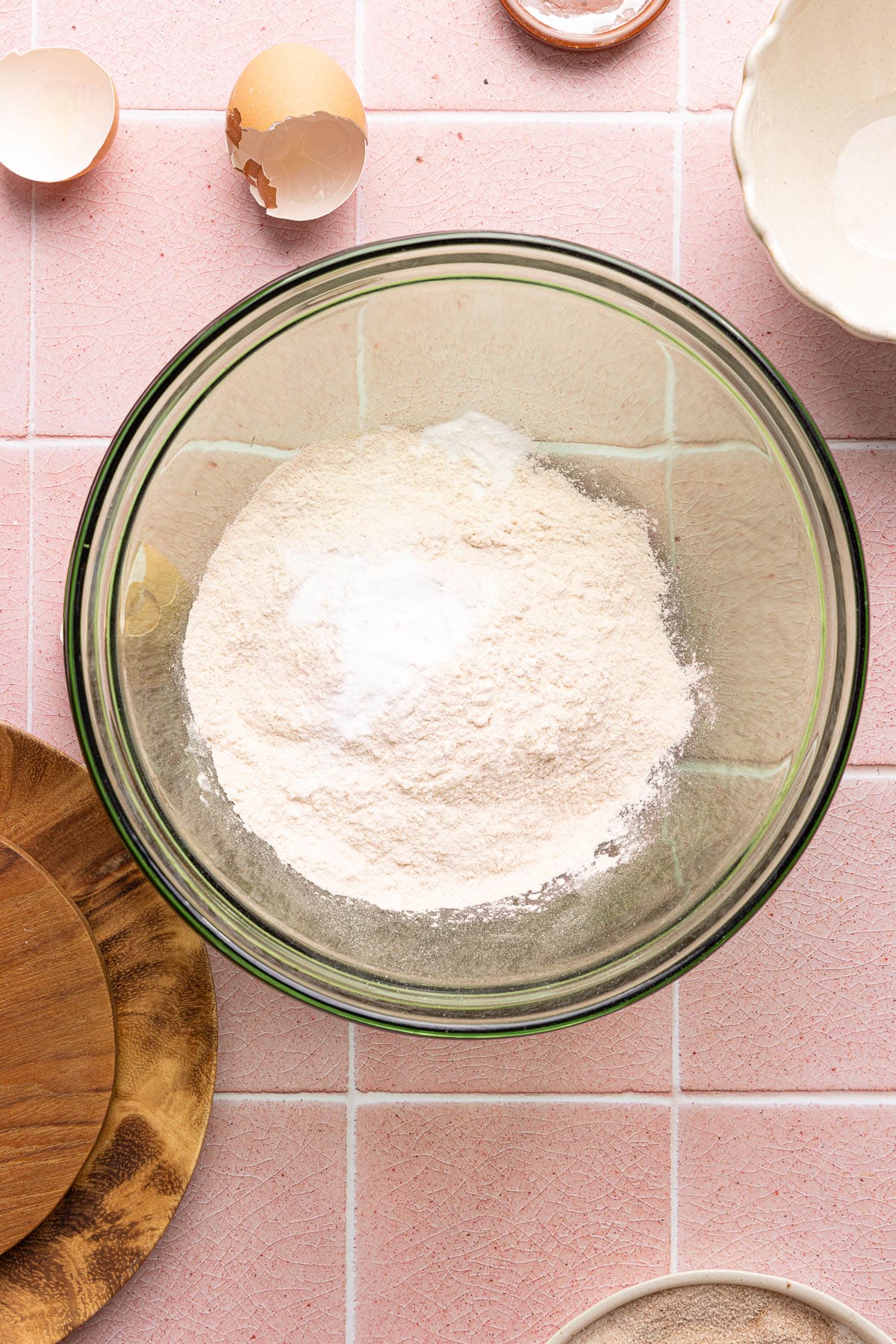 The flour and baking powder in a medium glass bowl before mixing.