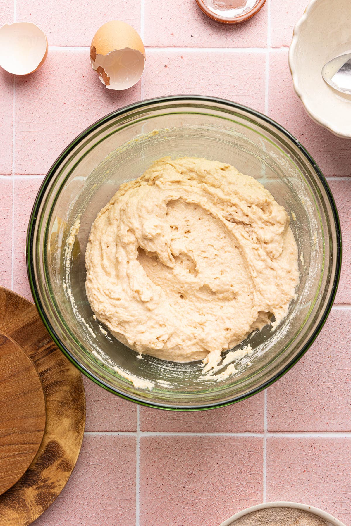 The wet and dry ingredients mixed together in a medium glass bowl.