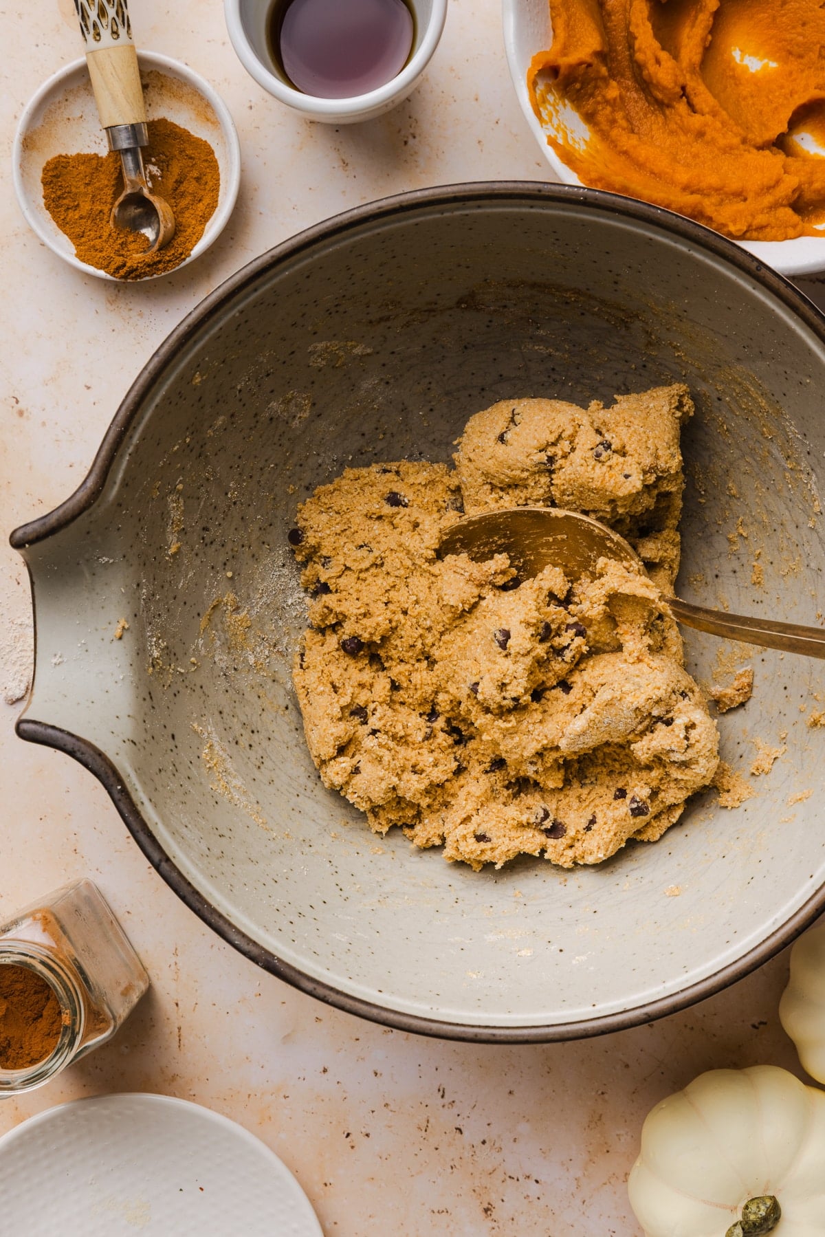 The edible pumpkin cookie dough mixture in a bowl after mixing everything together into a dough texture.