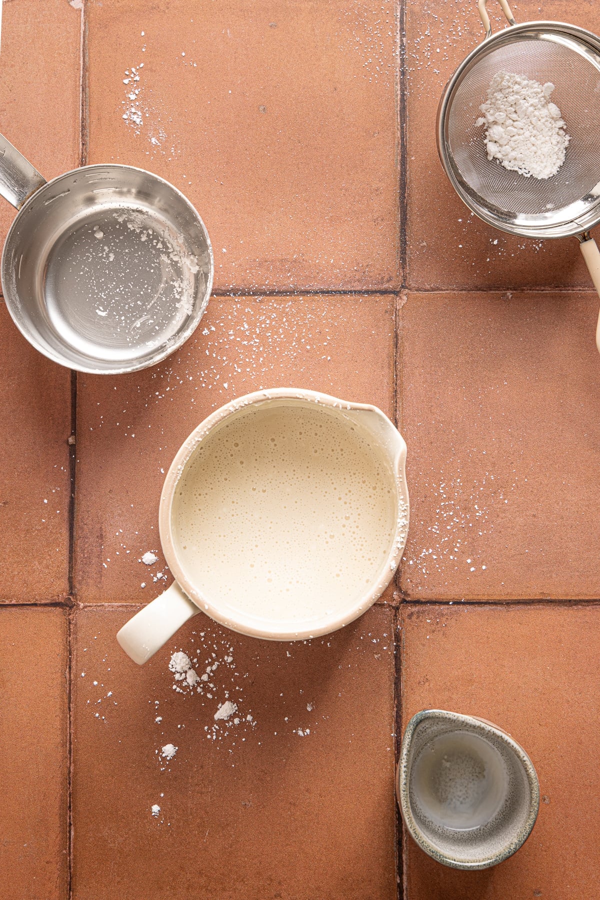 The glaze in a bowl before pouring over the cinnamon rolls.