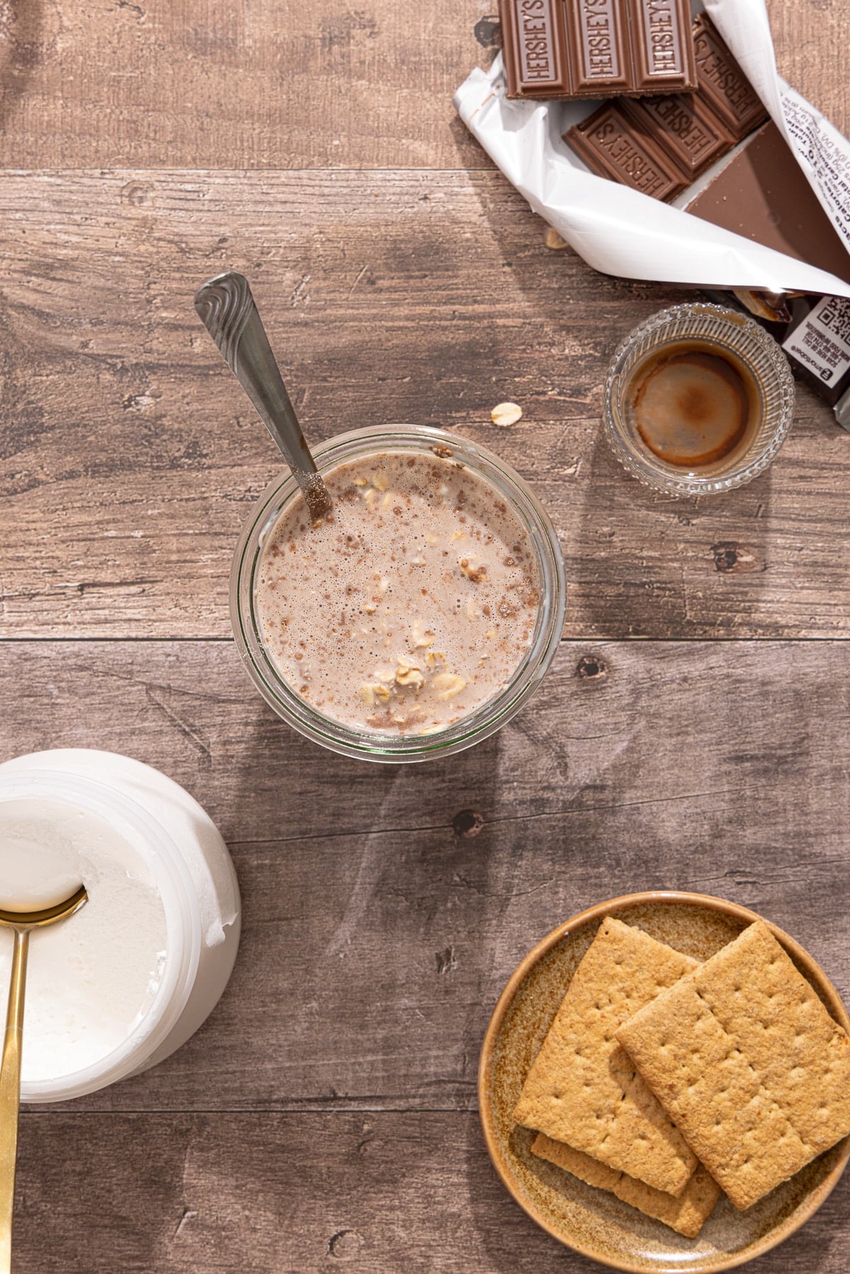 The mixed s'mores overnight oats mixture in the jar before chilling.