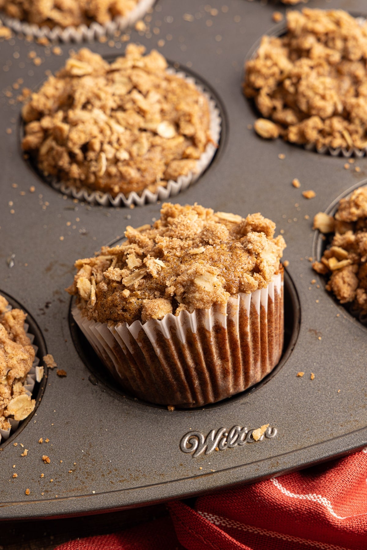 Apple oatmeal muffins in a baking pan after baking.