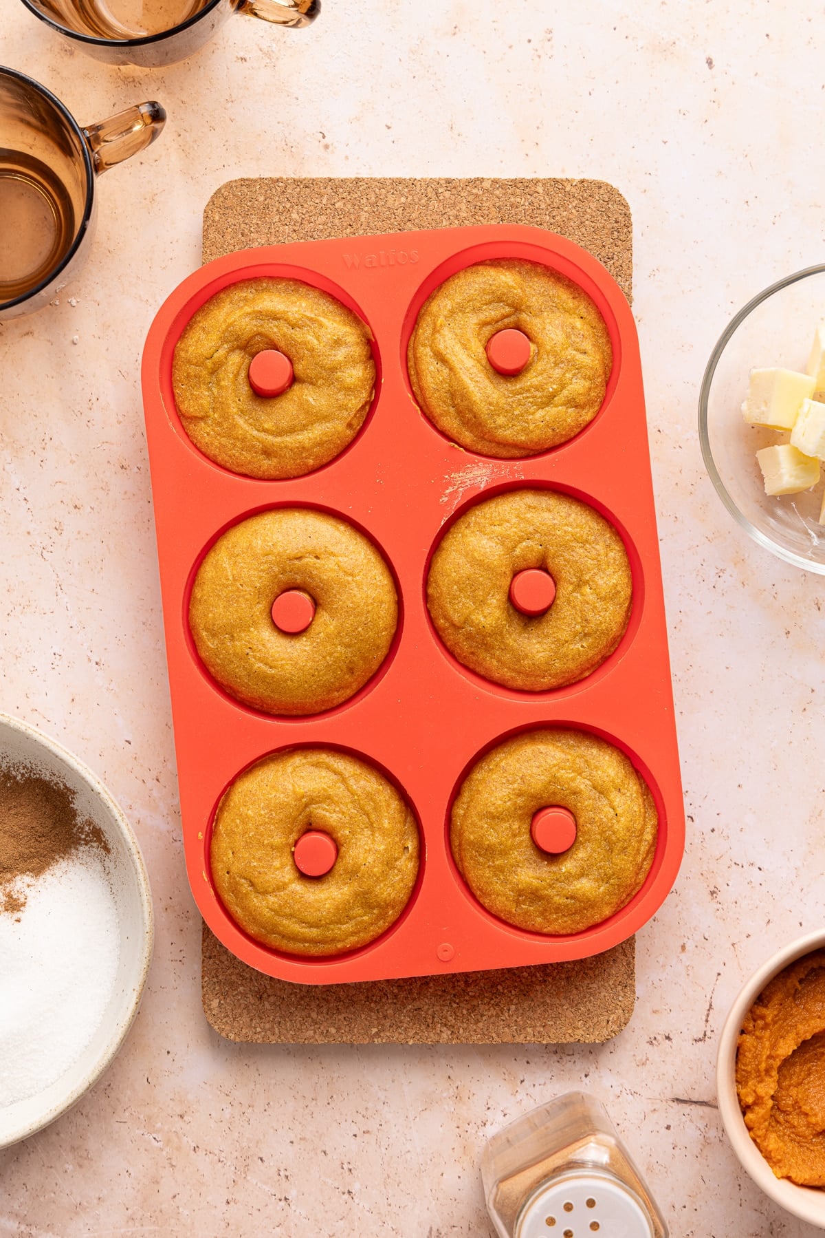 The donuts in the muffin pan after baking.