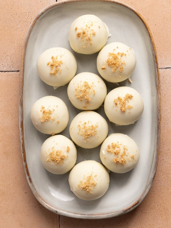 High protein pumpkin truffles sitting on a white serving platter.