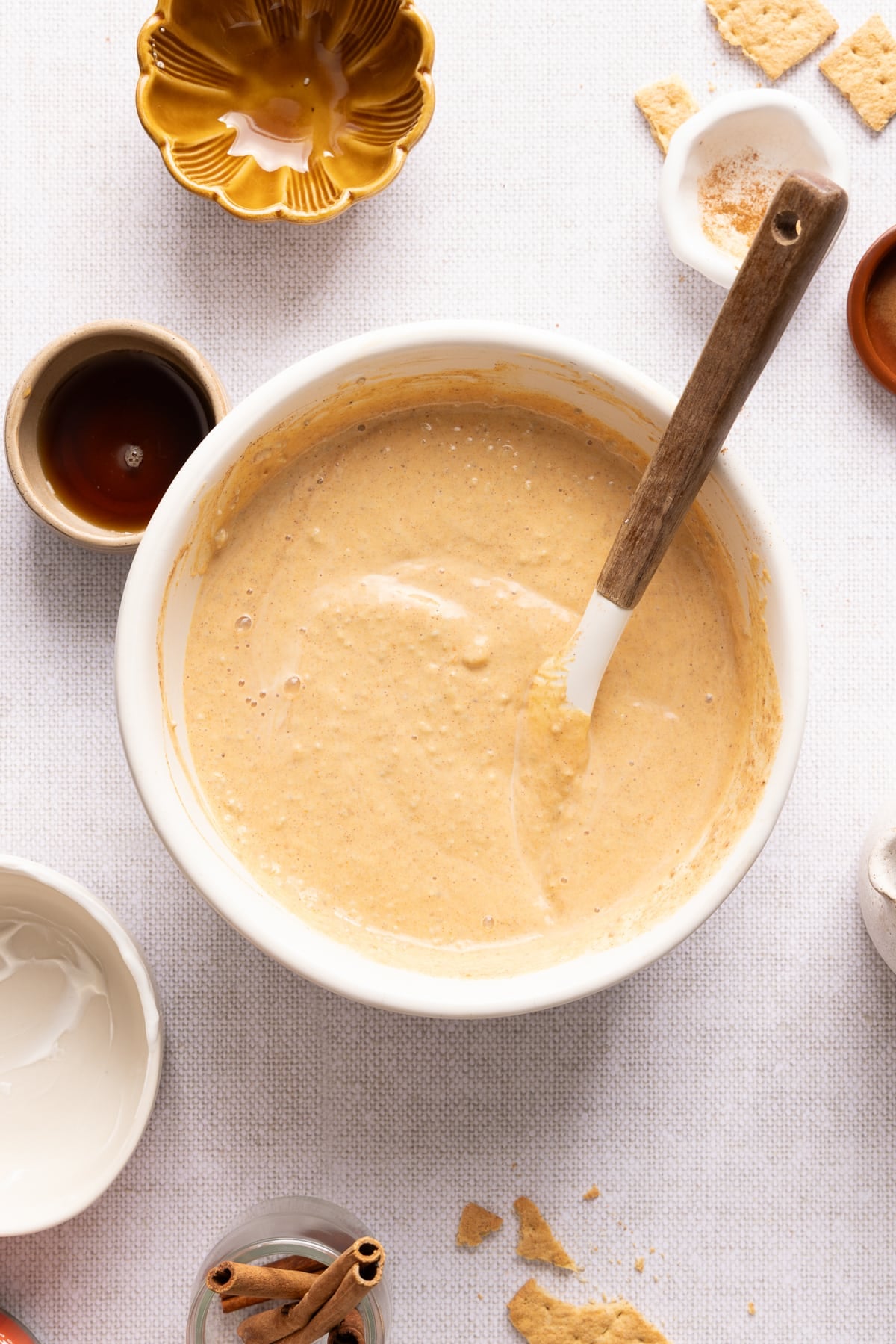 The pumpkin chia pudding mixture mixed together in a bowl on a countertop.