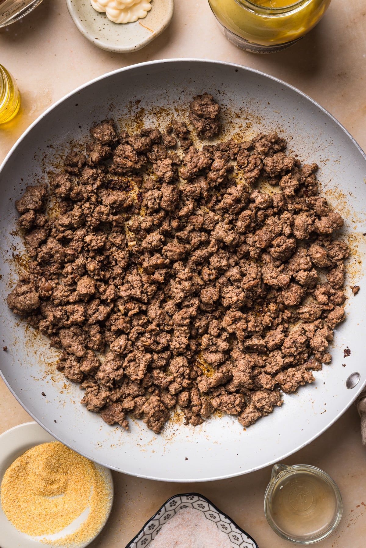 The ground beef cook in the skillet.
