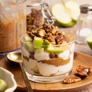 Green apple, date caramel and vanilla Greek yogurt layered in a glass jar.