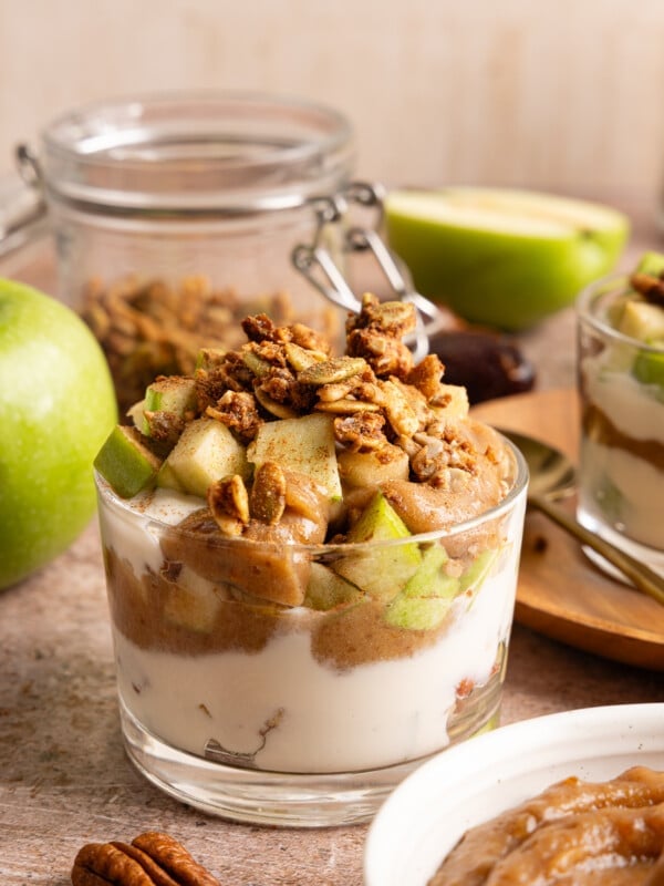 Green apple, date caramel and vanilla Greek yogurt layered in a glass jar.
