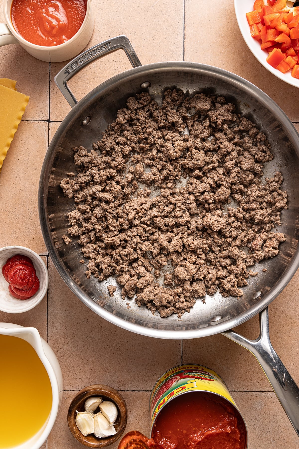 The browned meat in the skillet after cooking.