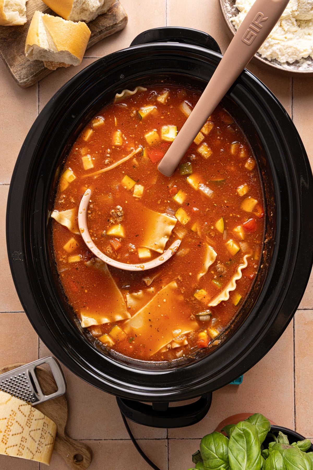 The lasagna soup in the slow cooker after cooking.